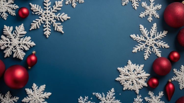 Christmas background with red ornaments and snowflakes on a dark blue surface, featuring a flat lay design and copy space.