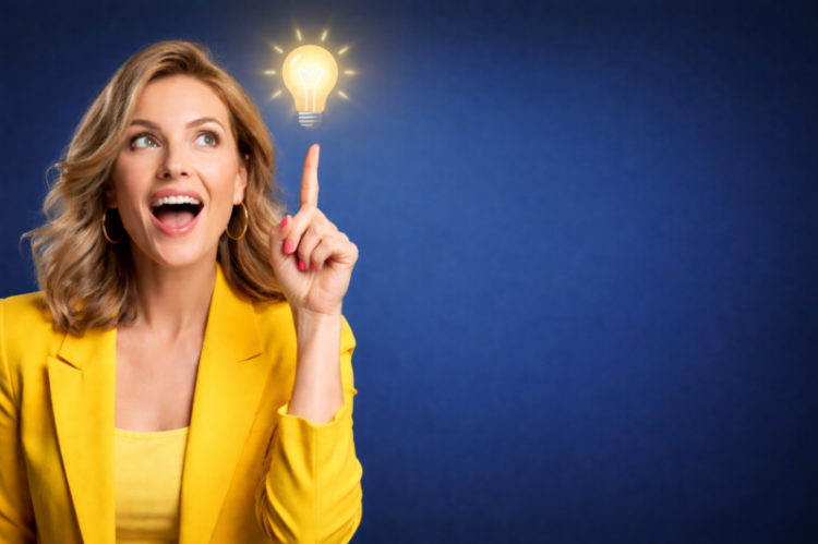 Smiling woman in a yellow blazer pointing up at a glowing lightbulb icon on a blue background representing a bright idea